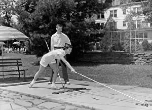 Shuffleboard: 1950s Boy And Girl Playing Deck