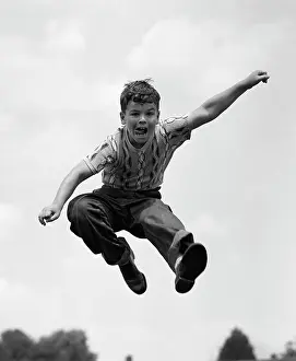 950s: 1950s Boy Jumping Up