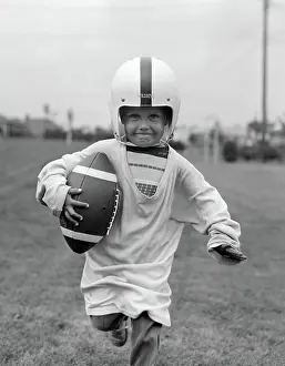 Lef001: 1950s BOY IN OVERSIZED SHIRT & HELMET RUNNING