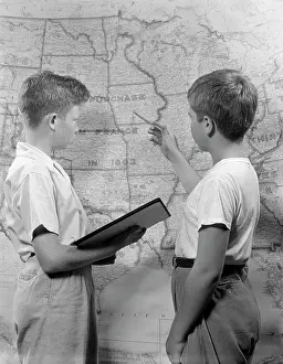 Classmates: 1950s TWO BOYS STUDYING MAP OF LOUISIANA PURCHASE