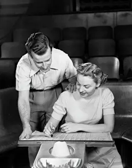 Scoreboard: 1950s Couple Bowling Looking At