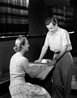 Scoreboard: 1950s Couple Bowling Looking At
