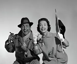 Topcoat: 1950s COUPLE PORTRAIT IN COATS ROOTING FOR HOME