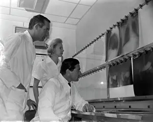 Radiology: 1950s TWO DOCTORS AND NURSE EXAMINING X-RAYS