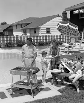 Preteen: 1950s Family In Backyard Beside