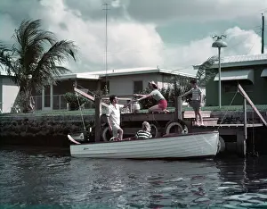 Picniking: 1950s Family Loading Picnic Into