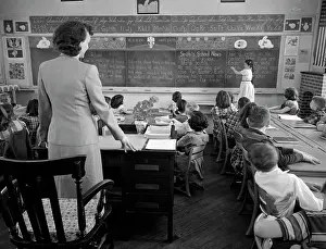 Schoolrooms: 1950s Girl At Front Of Classroom