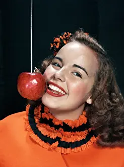 Bobbing: 1950's Girl Eating Apple On A String