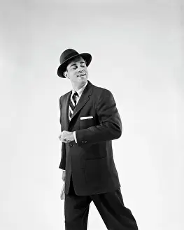 Forearm: 1950s Man In Business Suit Holding