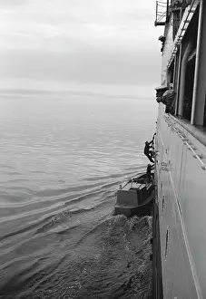 Egx001: 1950s Man Climbing Aboard Ship