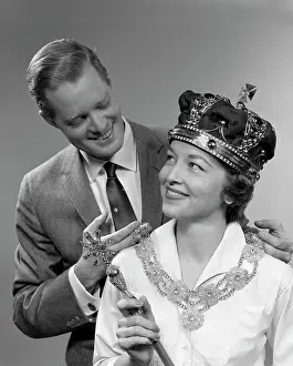 Occurrence: 1950s Man Holding Necklace On