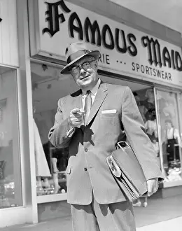 Headware: 1950s Man Pointing To Camera Holding