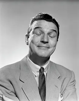Sublime: 1950s Man Smiling Eyes Closed