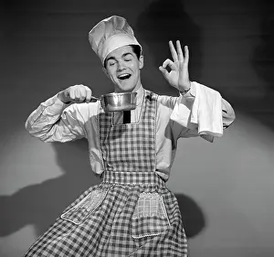 Househusband: 1950s Man Wearing Chefs Hat And