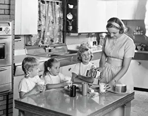 Peanut: 1950s Mother Three Daughters Standing Around Kitchen Tabl