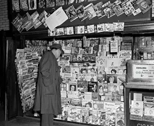 Topcoat: 1950s Newsstand Wwith Man Buying