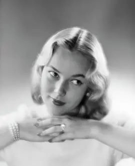 Coquette: 1950s PRETTY BLOND WOMAN CHIN RESTING ON HANDS