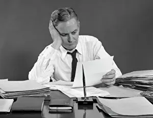 Overworked: 1950s Retro Man Business Paperwork