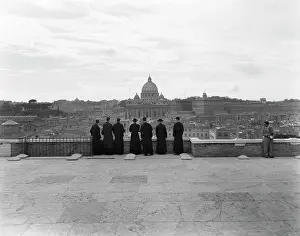 May001: 1950s rome italy back view of student priests