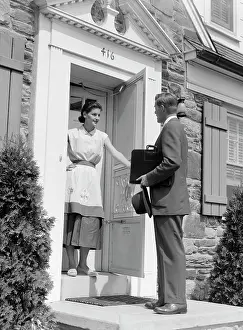 Doormat: 1950s Salesman At Door Talking