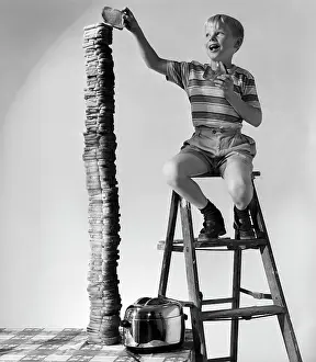 Toasted: 1950s Smiling Boy On Ladder Stacking