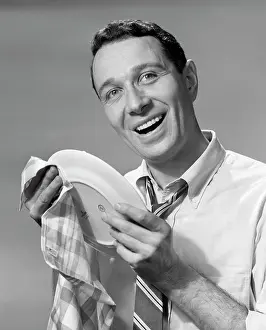Dishwashing: 1950s Smiling Man Drying Plate