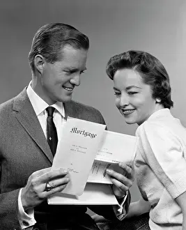 Mortgage: 1950s Smiling Portrait Couple