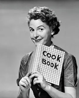 Cookbook: 1950s Smiling Woman Looking Over