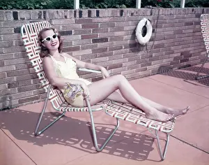 Basking: 1950s Smiling Woman Sun Bathing