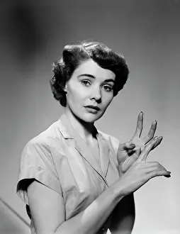 Spokesperson: 1950s SERIOUS WOMAN COUNTING ON HANDS