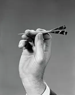 Grownups: 1960s 1970s HAND CLOSE-UP HOLDING ABOUT TO THROW