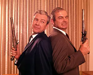 Duelling: 1960s 2 Businessmen Back To Back