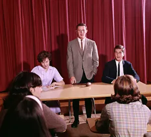 Coordinate: 1960s 3 Students At Table Boy