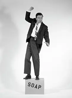 Orate: 1960s Angry Man In Suit On Soapbox