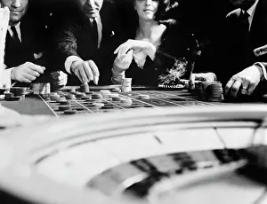 1960s four anonymous unidentified people gambling