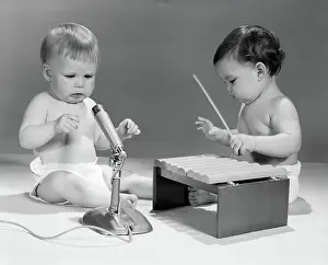 Diapers: 1960s TWO BABIES IN DIAPERS WITH MICROPHONE AND
