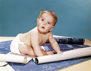 Drafting: 1960s Baby Architect Sitting Among