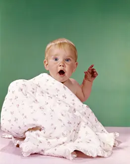 Peekaboo: 1960s Baby Partially Covered By