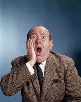 Bulging: 1960s Balding Businessman Holding