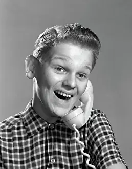 Nerds: 1960s BOY ON TELEPHONE WITH EXCITED EXPRESSION