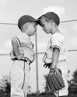Disagree: 1960s Two Boys Playing Baseball Arguing