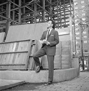 Egx001: 1960s Businessman On Curb Looking