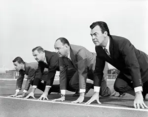 Businesspeople: 1960s FOUR BUSINESSMEN ON THE STARTING LINE