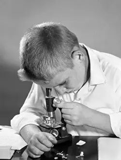 Microscopes: 1960s - Close-Up of Boy Looking Down Through Microscope
