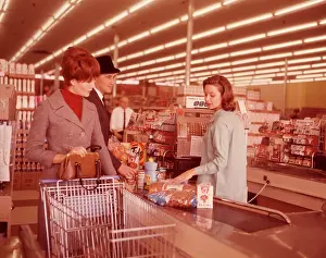 Checkout: 1960s Couple At Check Out Counter
