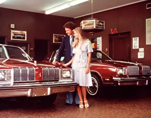 Dealership: 1960s Couple Looking At Car In