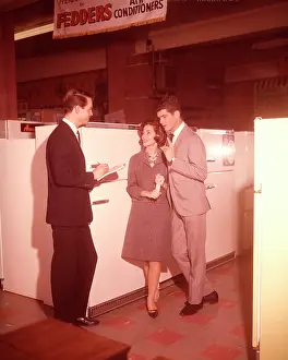 Salesperson: 1960s Couple Talking To Salesman