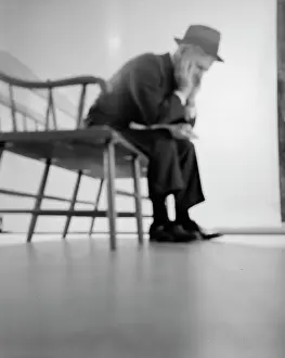 Elbows: 1960s Depressed Elderly Man Sitting