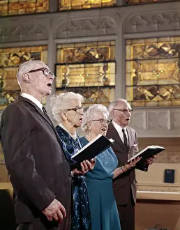 Hymnal: 1960s Two Elderly Couples In Church