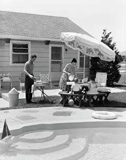 Grilling: 1960s Family Of Four Backyard